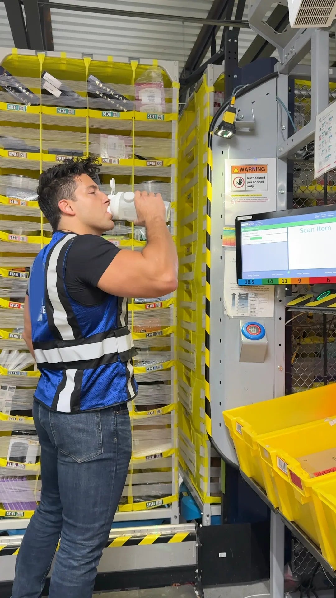 Worker drinking from his Mag Shaker magnetic bottle at a warehouse workstation
