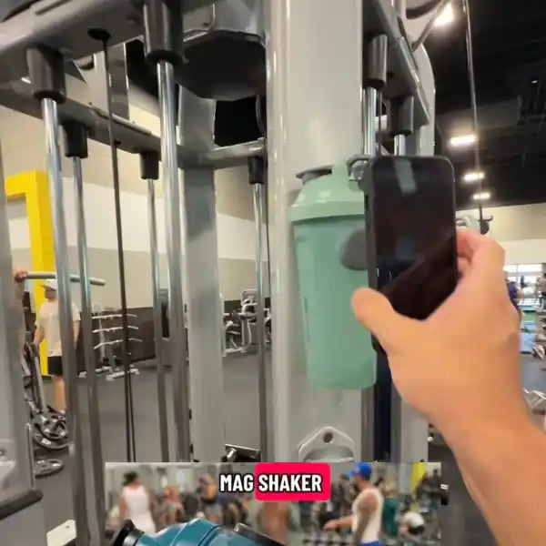 Mag Shaker magnetic bottle video showing bottle magnet mounting on gym equipment and phone mounting to opposite magnet on the Mag Shaker bottle while withstanding weight lifting equipment vibration
